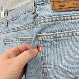 Vintage Levis 550 Jeans Slim Fit Tapered Leg Denim Light Wash Orange Tab Mens 36